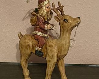 Santa trying to take off with Rudolf!