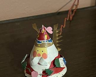 Santa can even snuff out candles for you