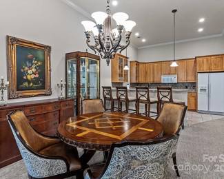 Frontgate 52” table with 4 upholstered & leather chairs