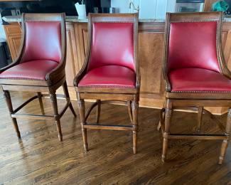Frontgate red leather bar-height bar stools.