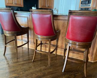 Frontgate red leather bar-height bar stools.