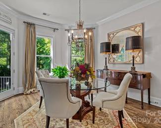 54” round glass top pedestal base table with 4 white leather chairs