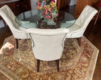 54” glass top table with wood pedestal base and 4 leather chairs, octagonal rug 8'