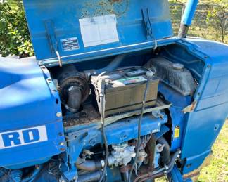 Rebuilt Ford 2600 Tractor with a disc plow, scoop, hay fork and blade. It has a lot of new: front tires, carburetor, fuel pump, hydraulic hoses to front cooler, brakes on rear, spark plug wires, fuel tank cleaned, new starter and fuel filter. New battery! **Taking bids only. Highest bidder at 3:00pm Sunday, Nov 23, takes the tractor and implements. Must be able to remove all items off the property.**