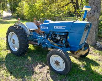 Rebuilt Ford 2600 Tractor with a disc plow, scoop, hay fork and blade. It has a lot of new: front tires, carburetor, fuel pump, hydraulic hoses to front cooler, brakes on rear, spark plug wires, fuel tank cleaned, new starter and fuel filter. New battery! **Taking bids only. Highest bidder at 3:00pm Sunday, Nov 23, takes the tractor and implements. Must be able to remove all items off the property.**