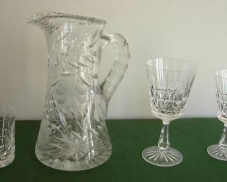 Lismore pattern by Waterford:  6 old fashions, 6 claret glasses, and 6 water goblets.  Large heavy cut glass pitcher.