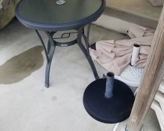 Table; umbrellas; umbrella stands