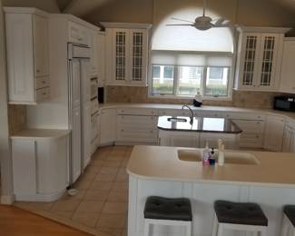 Kitchen is U-shaped with an island and a peninsula