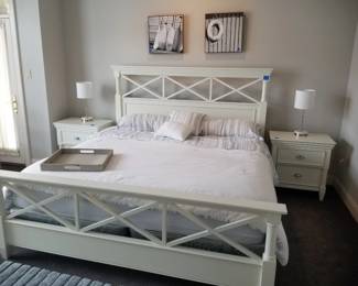 King bedroom suite by Magnussen Home: king bed; nightstands; long dresser with mirror 