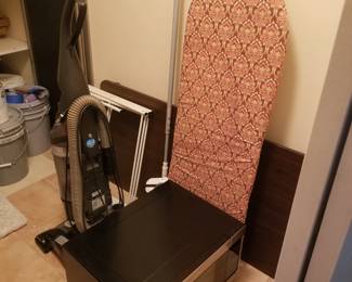 Ironing board; vacuum cleaner