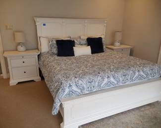 King bedroom suite: king bed; nightstands; long dresser with mirror