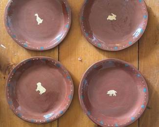 Set of Four Terracotta Plates with Animal Motifs 