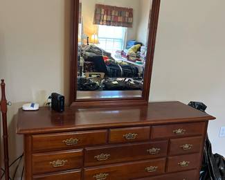 #84	Wood dresser w/11 drawers & Beveled Mirror - 82x19x33  Mirror - 30x52	 $175.00 			
