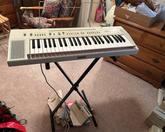 #55	Yamaha Keyboard PS20 Keyboard w/power Cord and Stand w/adapter	 $150.00 			
