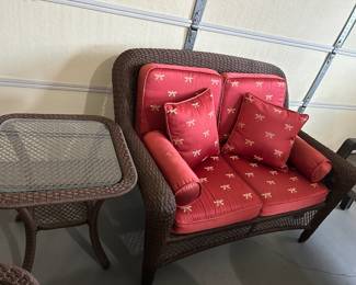 #100	Brown Plastic Wicker Loveseat  - 48" w/cushions w/Square Round  Table w/Glass  Top  Table - 22x24	 $100.00 			
