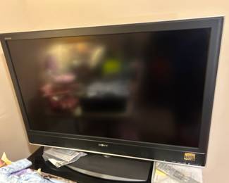 #43	Sony TV - 46" w/remote  Model  KDL46V 251	 $75.00 			
#44	Black Laminate Metal/Glass TV Stand w/2 shelves 42x25x23	 $35.00 			
