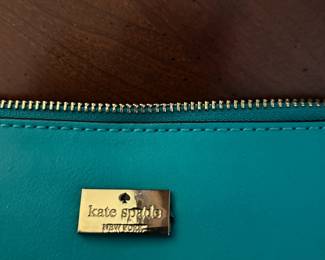 #73	Teal Kate Spade Shoulder/Cross Body Bag	 $40.00 			
