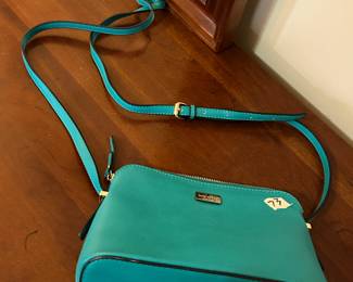 #73	Teal Kate Spade Shoulder/Cross Body Bag	 $40.00 			
