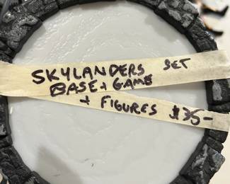 #123	Wii Skylander base and figures	 $35.00 			
