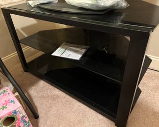 #43	Sony TV - 46" w/remote  Model  KDL46V 251	 $75.00 			
#44	Black Laminate Metal/Glass TV Stand w/2 shelves 42x25x23	 $35.00 			
