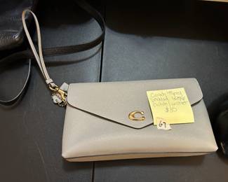 #67	Coach lilght Grey pebled Leather Clutch/Wristlet	 $35.00 			
