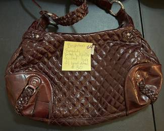 #64	Brighton Burgandy Patent Leather Guilted Bag w/brand Detail	 $30.00 			
