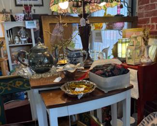 a gorgeous tiffany style lamp, nesting tables, shelves