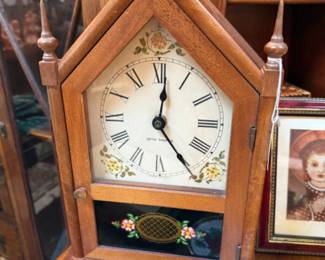 Small flocked Christmas tree with red berries and decorative base