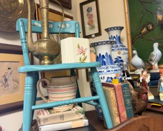 brass decor, blue and white and a pretty blue chair