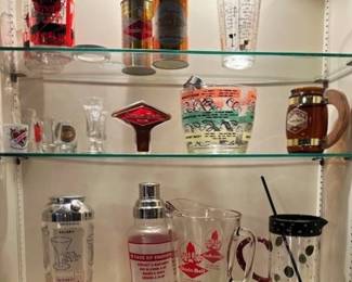 Collection of Grain Belt pitcher, cans, tap handle, and vintage shakers and measuring accessories