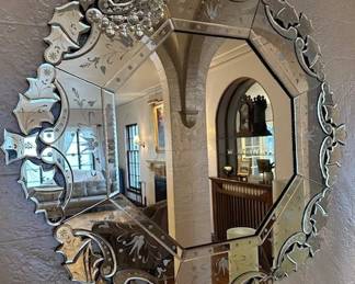 Elegant Venetian-style round wall mirror intricately cut, etched and beveled