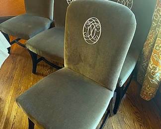 Set of 6 upholstered velvet dining chairs in an olive/taupe color with custom mogogram detail and dark wooden legs