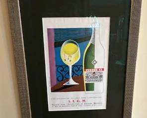 Framed wine bottle art.
