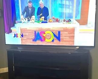 2018 LG, Model 65C8AUA TV and TV stand.