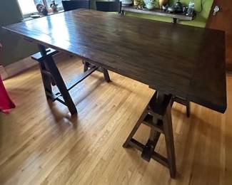 Adjustable table.  It's very cool, has some damage on a few of the board ends (puppy) but can be repaired by a hand person.  