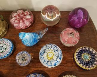 Glass paperweights, some signed. 