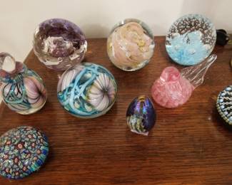 Glass paperweights, some signed. 