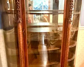 Late 1800's Lion Clawfoot Curved Glass China Cabinet.  It's been in our family over 100 years.  Beautiful...