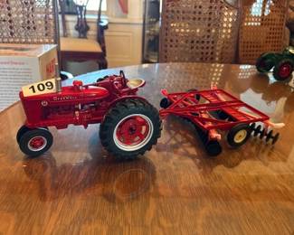 IH FARMALL M ERTL TOY TRACTOR WITH DISK