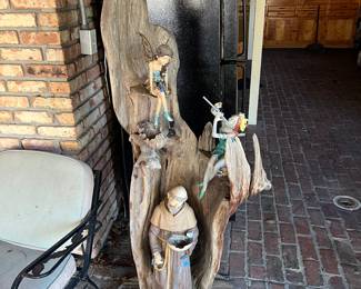 Cypress hand-carved wood sculpture garden ornament featuring figures of fairies and a monk