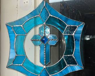 blue stained glass suncatcher with a cross design