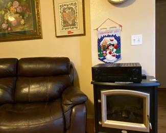 Dimplex freestanding electric fireplace, Seiko melody wall clock, matching leather power reclining sofa and lounge chair