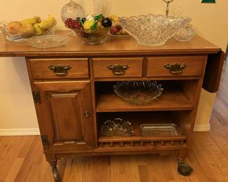 Vintage serving cart in same design as china cabinet, hutch, buffet table and side table. Italian stone fruit displayed with crystal bowls.