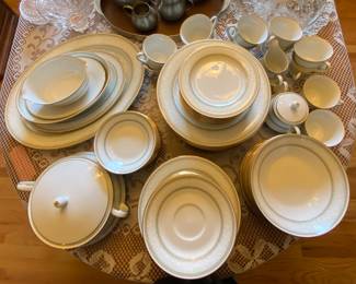  China dish set and oak dining table with four chairs