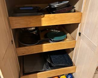 Lots of kitchen items, pots and pans and baking items.