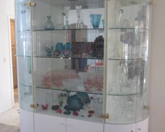 Display Cabinet, Lighted & Mirrored, Glass Shelves and Lower Storage Cabinets, Center 36" X 78" High. NOTE: Both Curved End Units Feature an Assortment of Waterford Selections! Each Side 18" X 78" High.