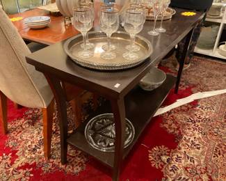 Dark hardwood console table with shelf. $150 + tax