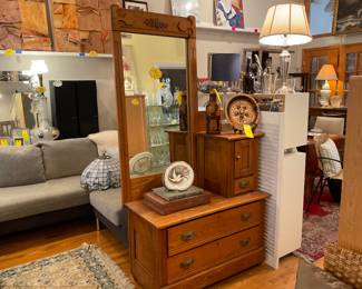 Antique hardwood rolling dresser with mirror detail. - $200 + tax