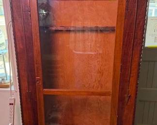 Solid wood gun cabinet. Glass front. https://modestlambestatesales.hibid.com/
