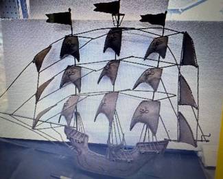 MCM metal wall art. https://modestlambestatesales.hibid.com/